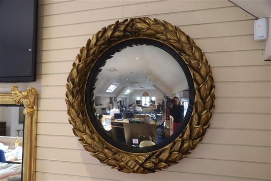 A fine large Regency giltwood and gesso convex wall mirror, Diam.3ft 6in.
